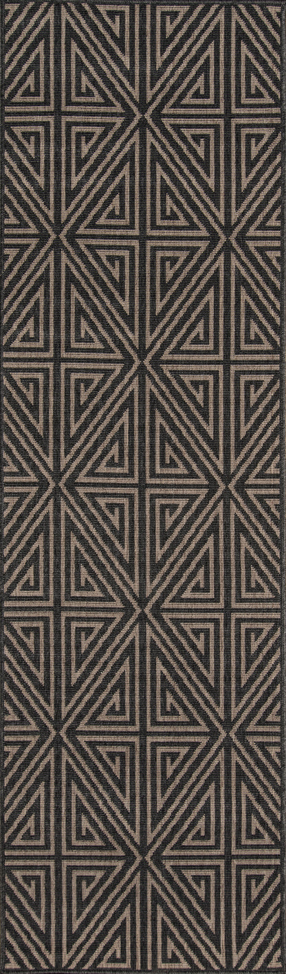 Rectangular area rug in black and tan with interlocking triangle motifs; modern tribal geometric pattern for living room.