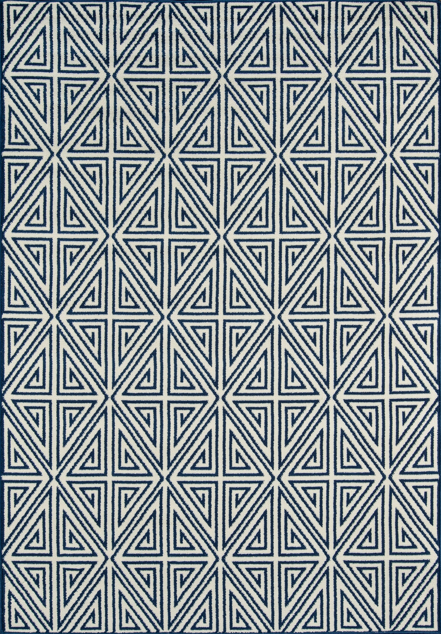 Navy blue rug with a white nested-triangle geometric pattern in a repeating grid.