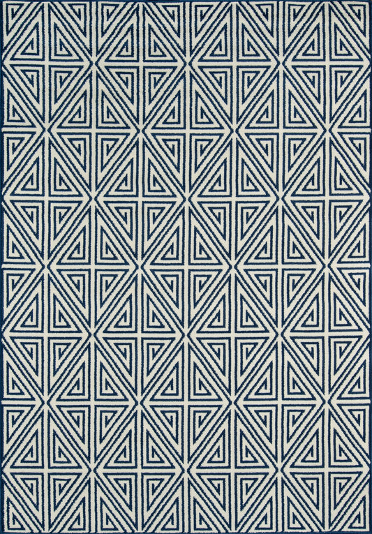 Navy blue rug with a white nested-triangle geometric pattern in a repeating grid.