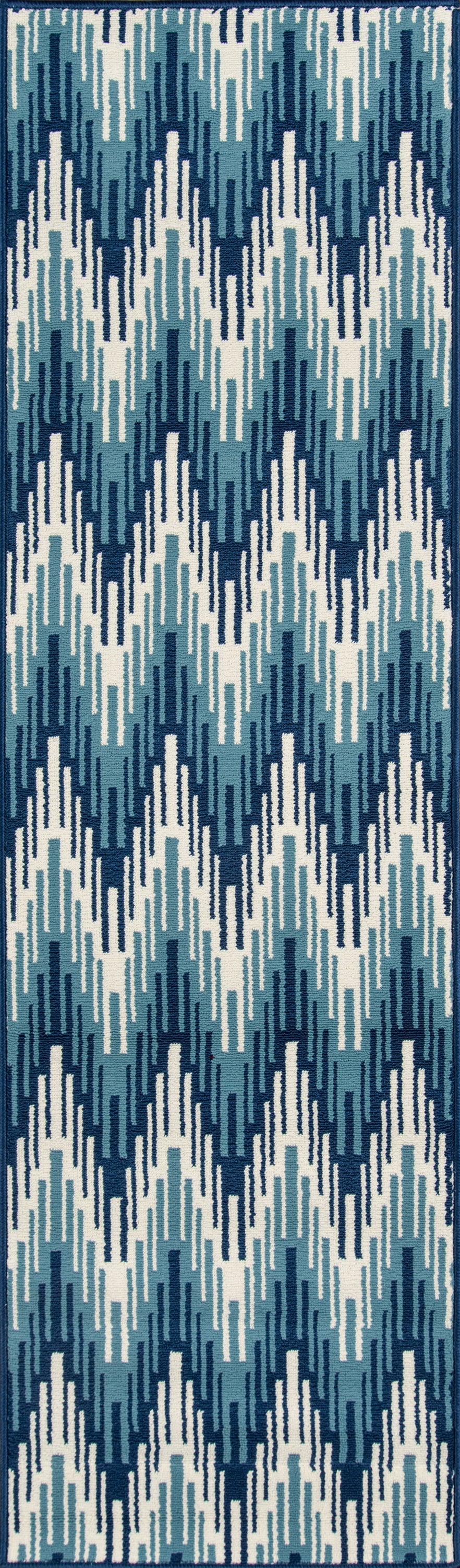 Blue, teal and white geometric rug with vertical zigzag blocks, ikat-inspired pattern for modern coastal decor.