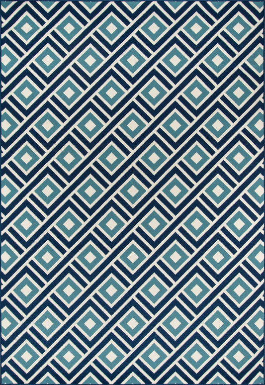 Diagonal repeating geometric print in navy and teal diamond motifs; bold textile or wallpaper decor.