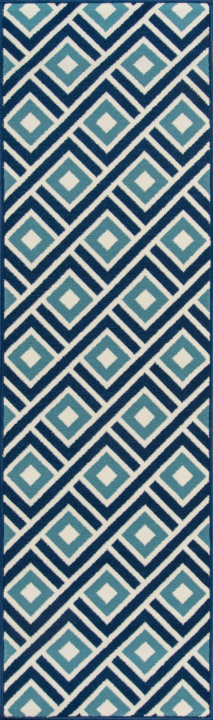 Navy geometric rug with diagonal teal and light blue diamond motifs outlined in white.