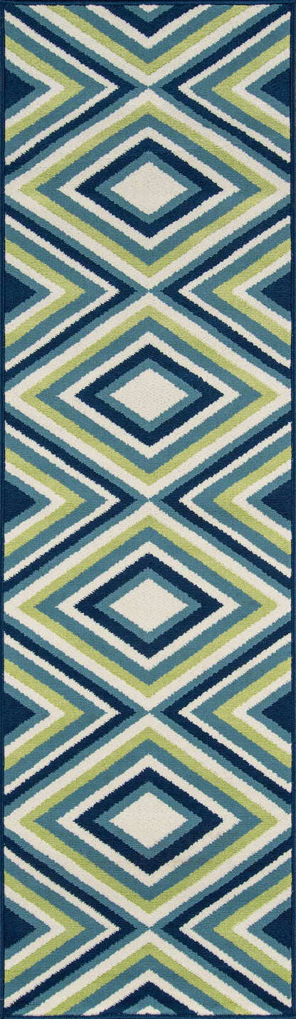 Geometric diamond-pattern area rug in teal, navy, lime green and white; bold coastal modern style.