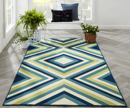 Rectangular geometric chevron area rug in teal, navy, lime and cream for modern living rooms.
