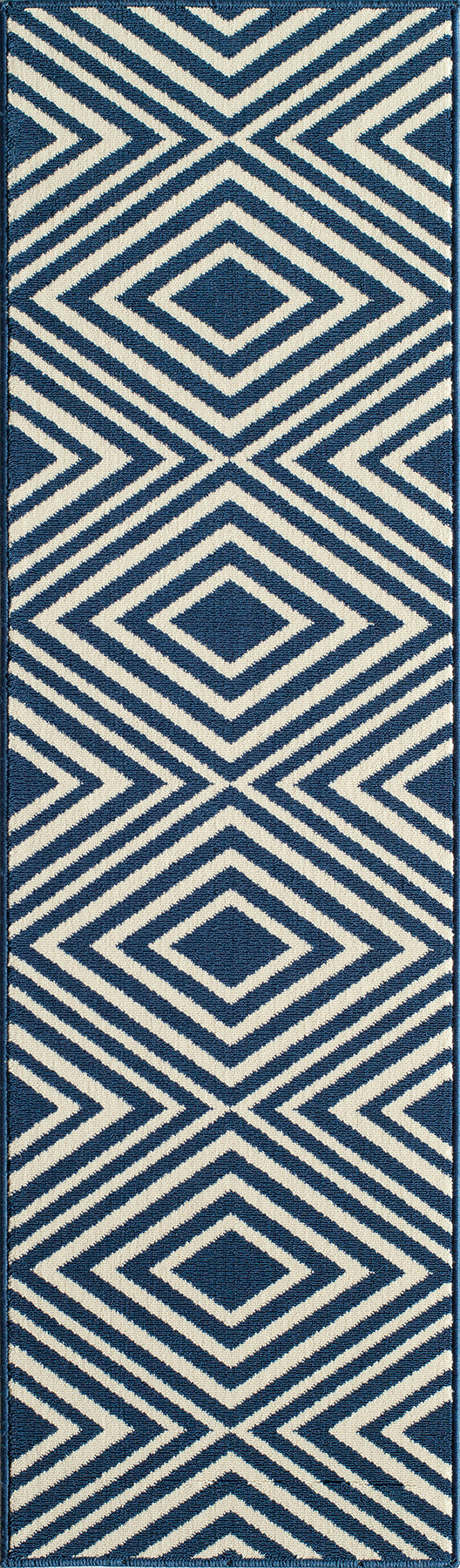 Blue and white diamond-pattern rug with woven texture; bold geometric coastal decor.