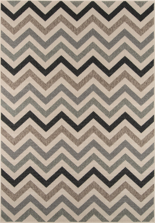 Soft woven rug with a chevron zigzag pattern in charcoal, gray, taupe and beige.