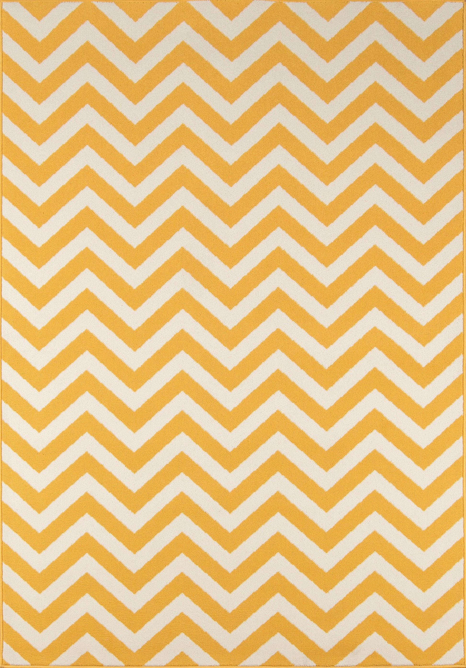 Mustard-yellow rug with white chevron zigzag pattern; bold geometric decor accent.