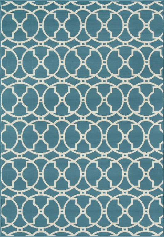 Teal blue rug with white interlocking circles forming a geometric lattice; contemporary coastal rug for living room.
