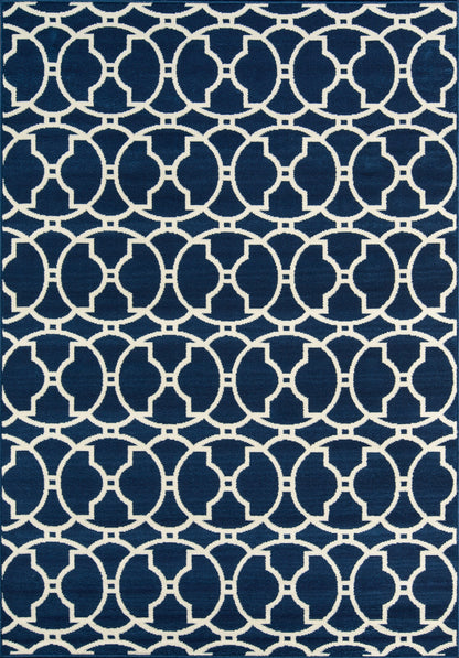 Navy blue rug with white interlocking circular lattice pattern; modern geometric decor.