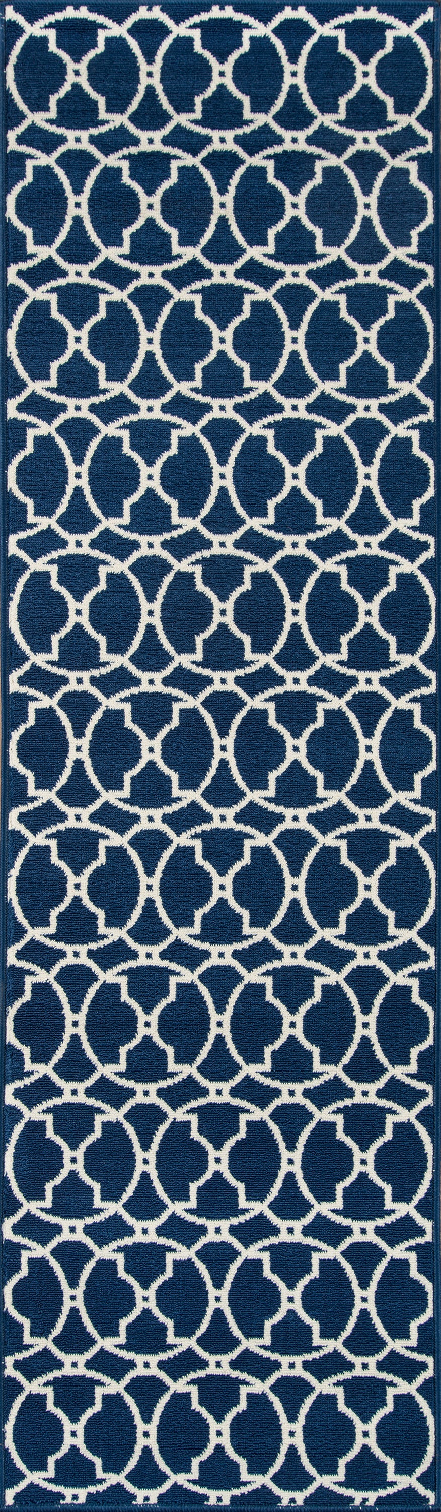 Navy blue rug with a repeating white interlocking circle lattice pattern; geometric rug design for home decor.