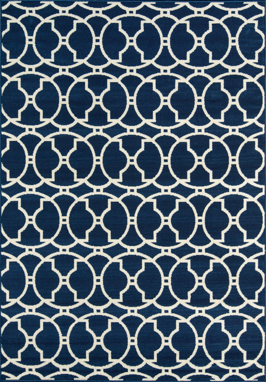 Navy blue area rug with white interlocking circle lattice pattern; modern geometric weave for living room decor.