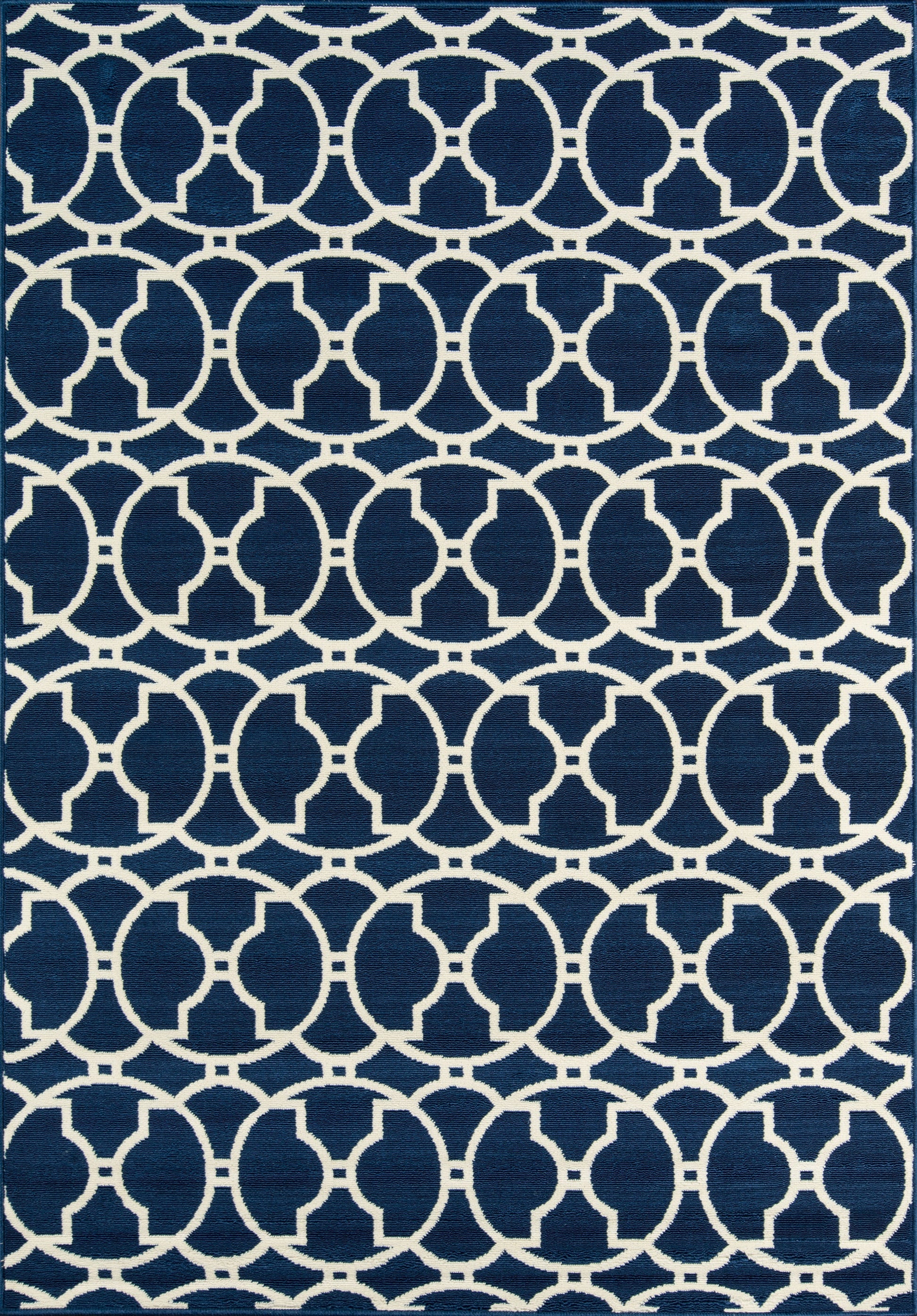 Navy blue flat-weave rug with white interlocking circular lattice pattern; geometric, modern home decor.