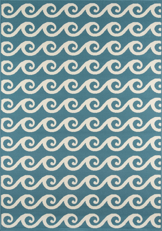 Blue textile with white looping wave pattern in repeating scrolls; coastal style.