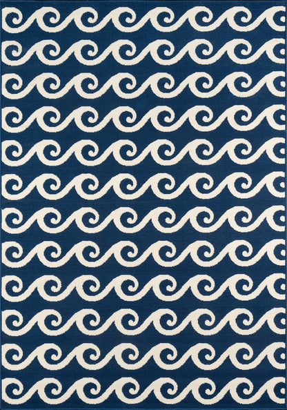 Rectangular navy rug with repeating white wave swirls, coastal style, dark border.