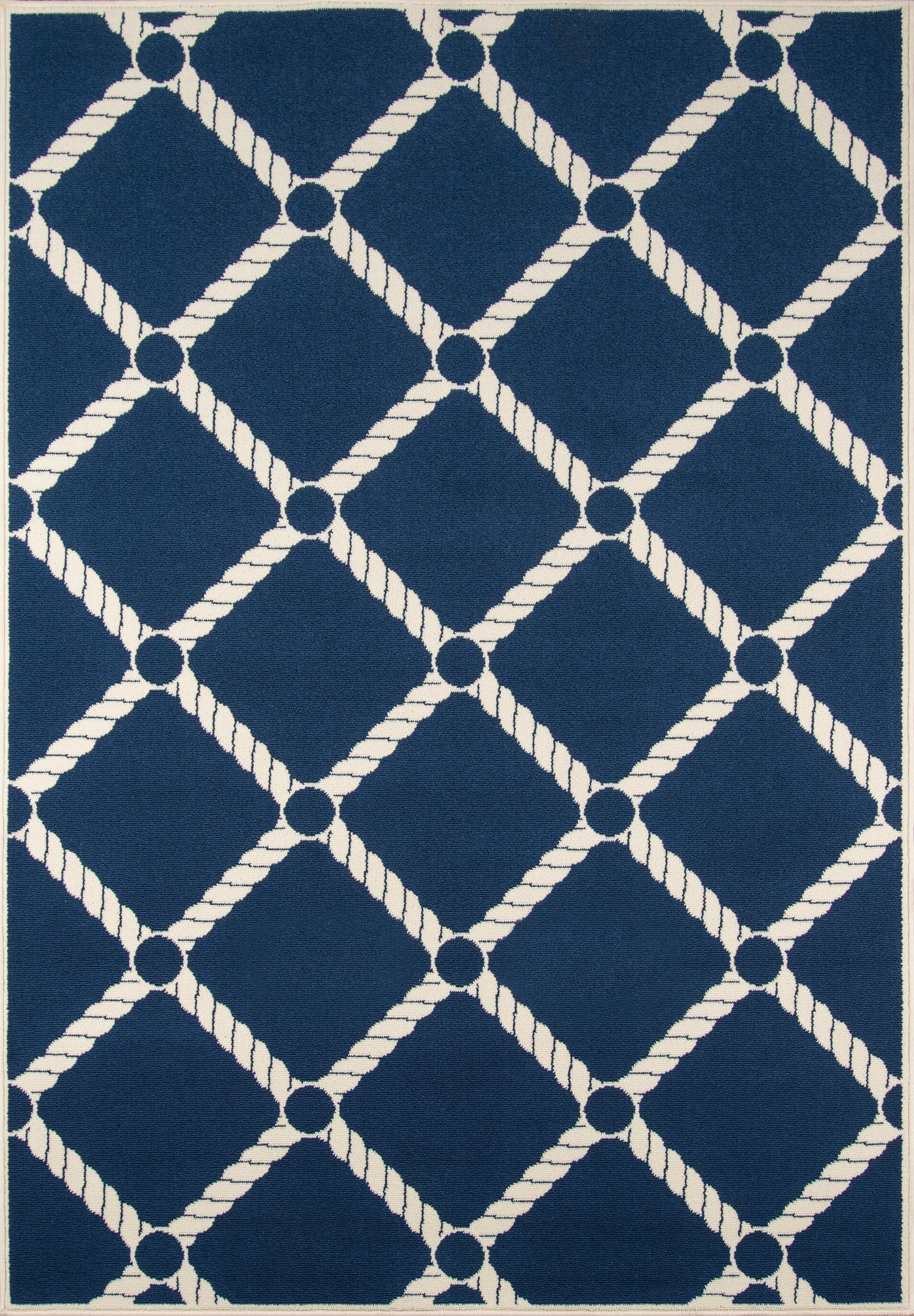Navy blue rug with a white rope-diamond lattice pattern and circular nodes at intersections.