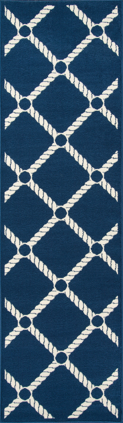 Navy blue rug with a white rope lattice pattern forming diamond shapes; nautical trellis motif, 7' x 10'.