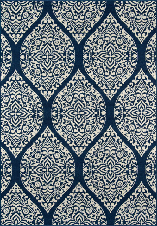 Navy blue fabric with white damask/arabesque medallion pattern, repeating ornate motifs for upholstery or drapery.