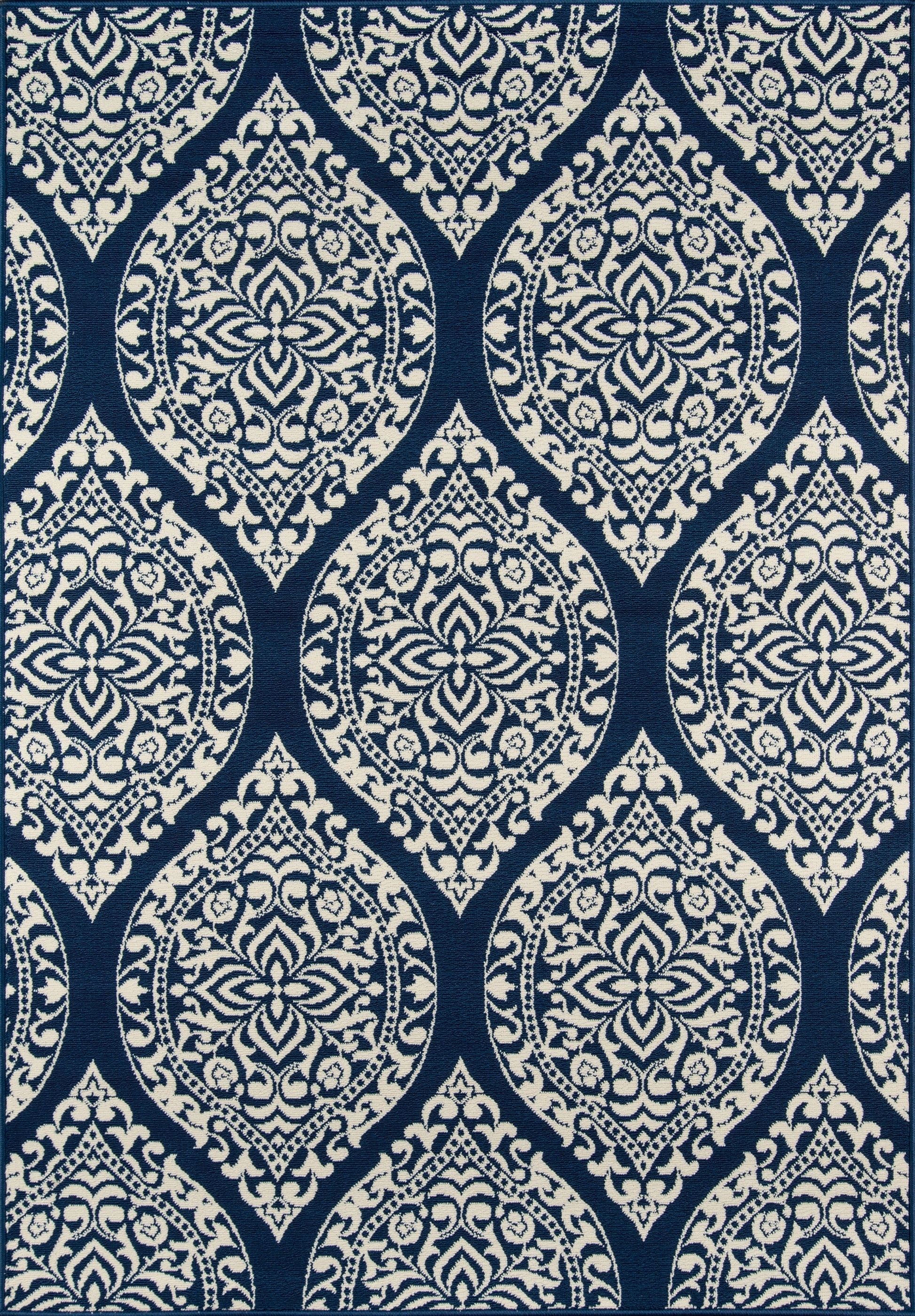 Navy blue textile with white damask teardrop medallions and ornate floral scrolls in repeating pattern.