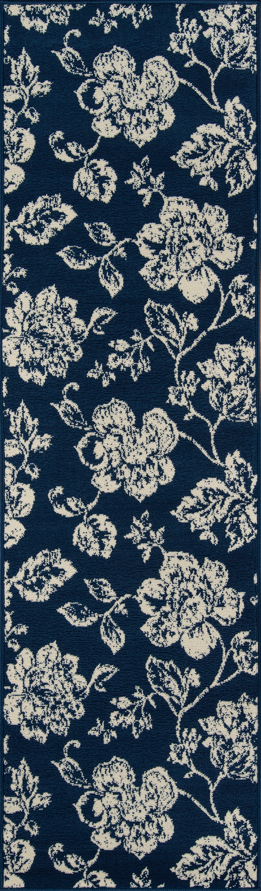 Navy rug with a cream floral pattern of roses and vines.