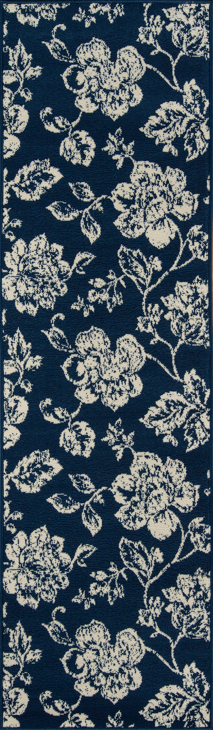 Navy rug with a cream floral pattern of roses and vines.