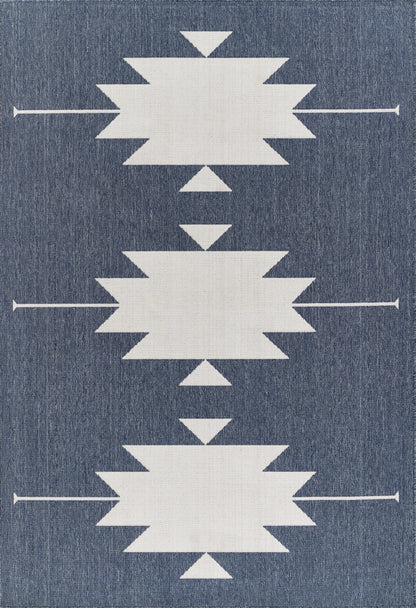 Denim-blue rug with three large white starburst shapes and small triangles, arranged in a vertical pattern.