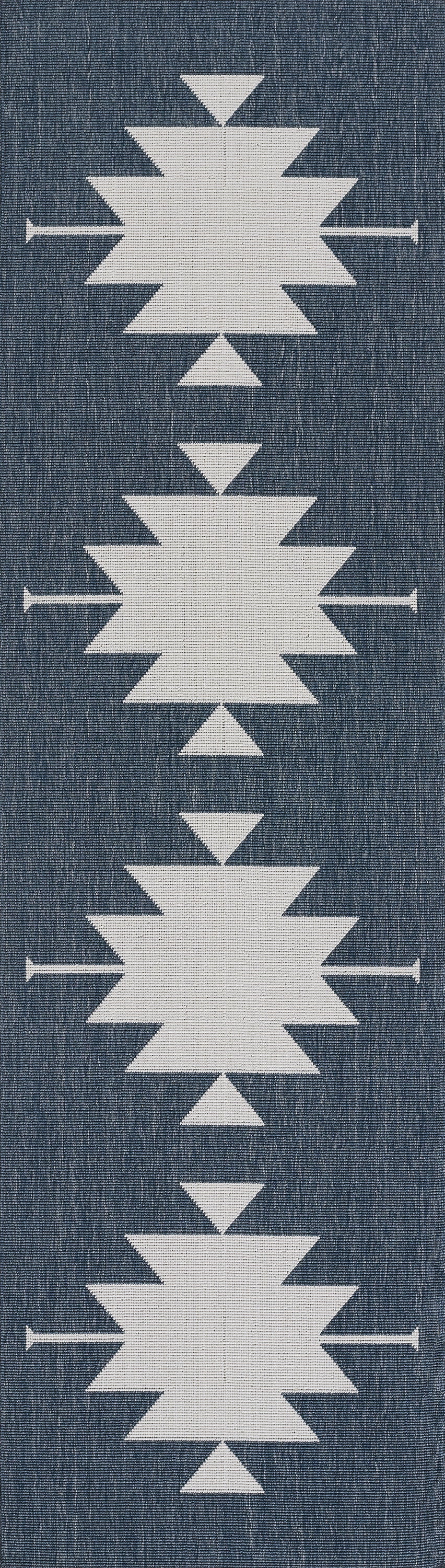 White geometric starburst motifs on blue denim fabric, arranged in a vertical column.