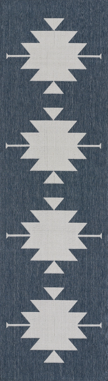 White geometric starburst motifs on blue denim fabric, arranged in a vertical column.