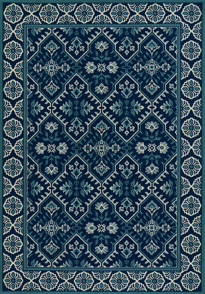 Teal and navy woven area rug with diamond lattice and light blue floral medallions, framed by a cream geometric border.