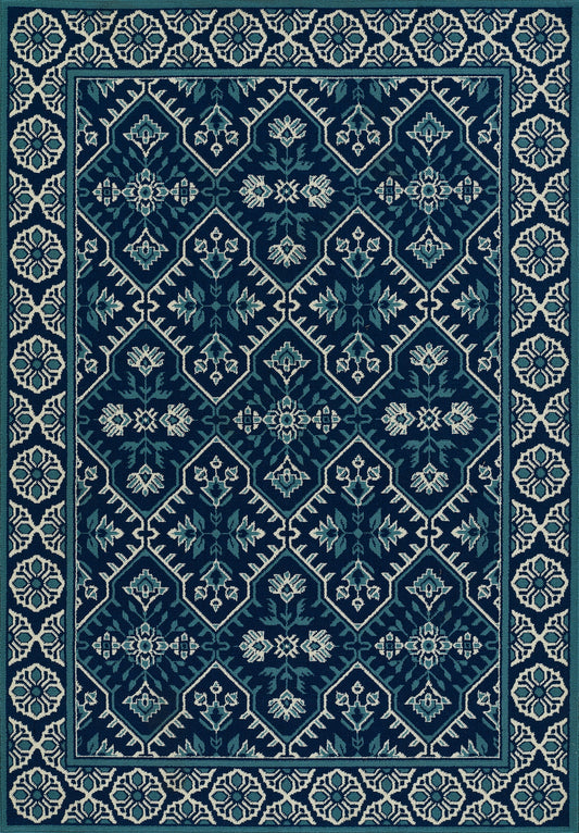 Teal and navy woven area rug with diamond lattice and light blue floral medallions, framed by a cream geometric border.