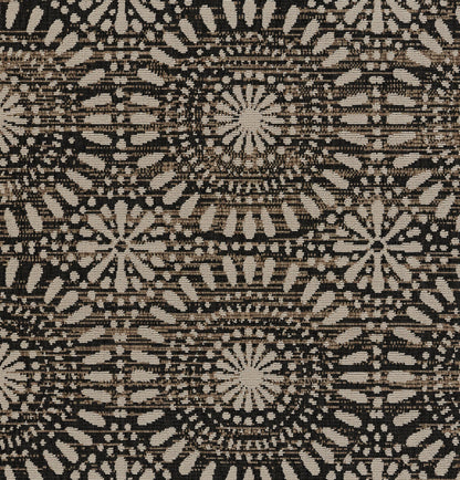 Beige and black woven rug with repeating circular mandala rosettes and geometric radiating pattern.