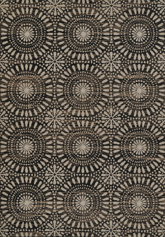 Beige and dark brown woven textile with repeating circular sunburst medallions; rustic boho rug.