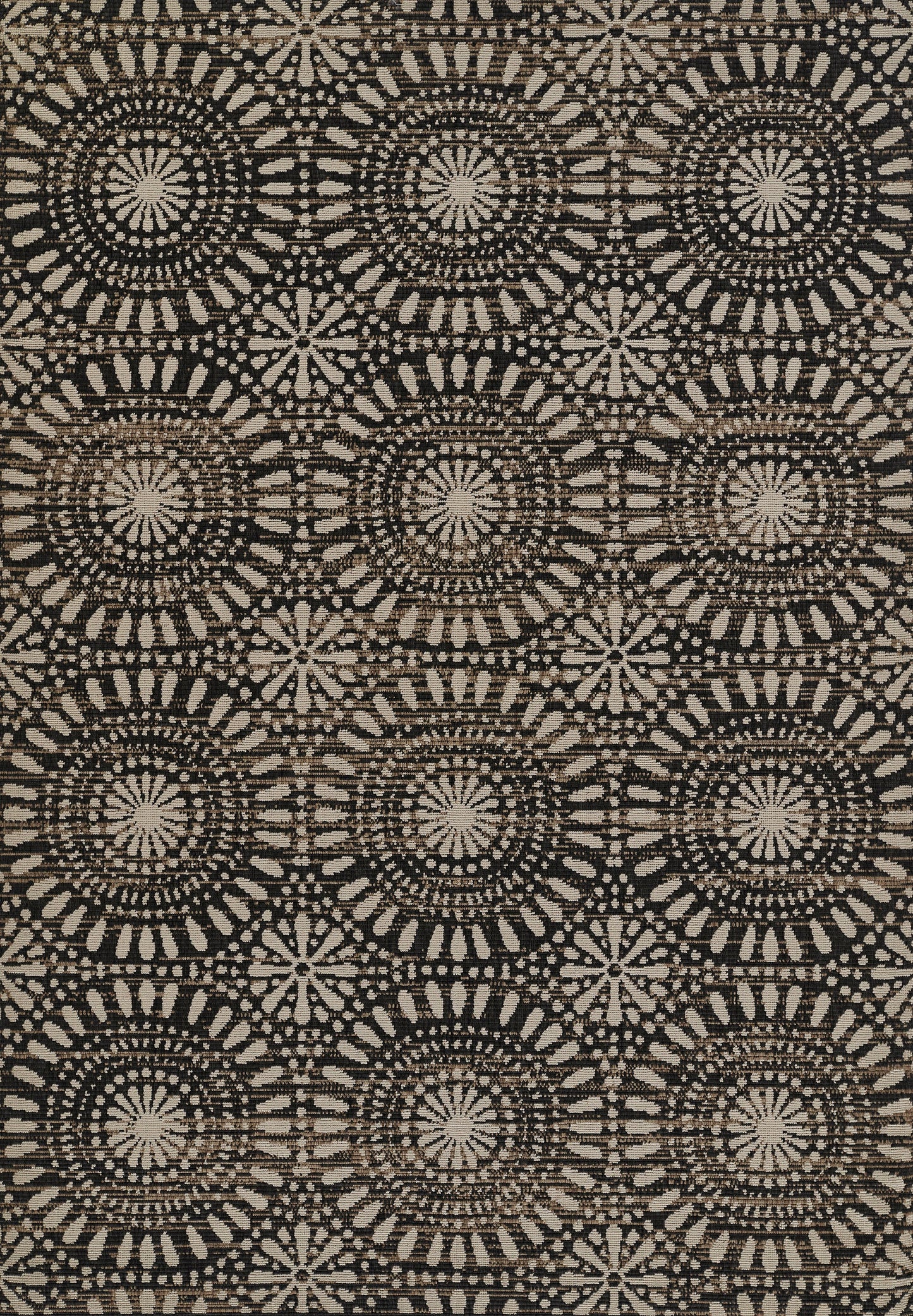 Brown and beige woven rug with a repeating circular starburst medallion pattern; 4' x 6' area rug.