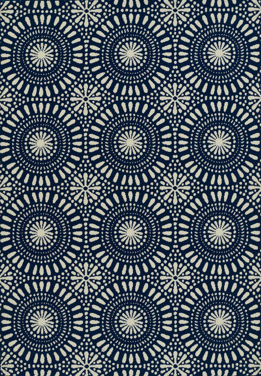 Navy blue rug with cream circular mandala patterns; concentric rings of dots and dashes form a bold geometric print, 2' x 4'.