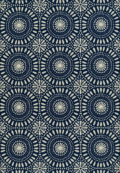 Navy rug with cream circular mandala motifs in radial spokes; repeating geometric boho pattern.