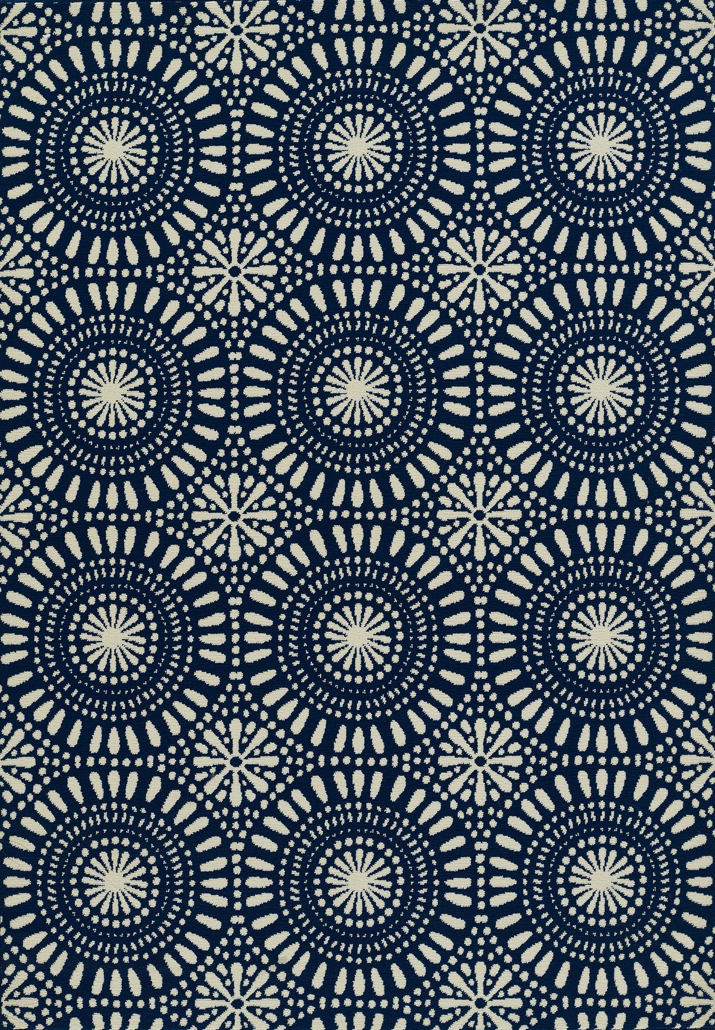 Navy rug with repeating ivory circular mandalas, sunburst centers & dotted rings; bold pattern.