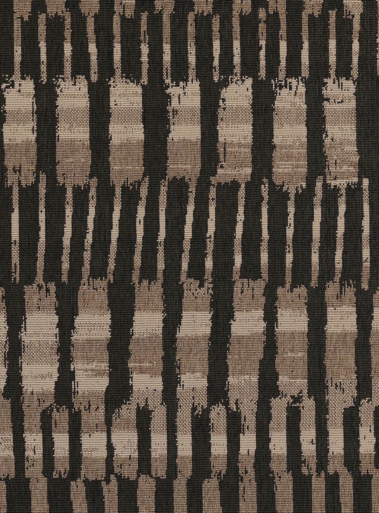 Tan, brown and black woven rug with vertical brushstroke stripes; rustic boho home decor.