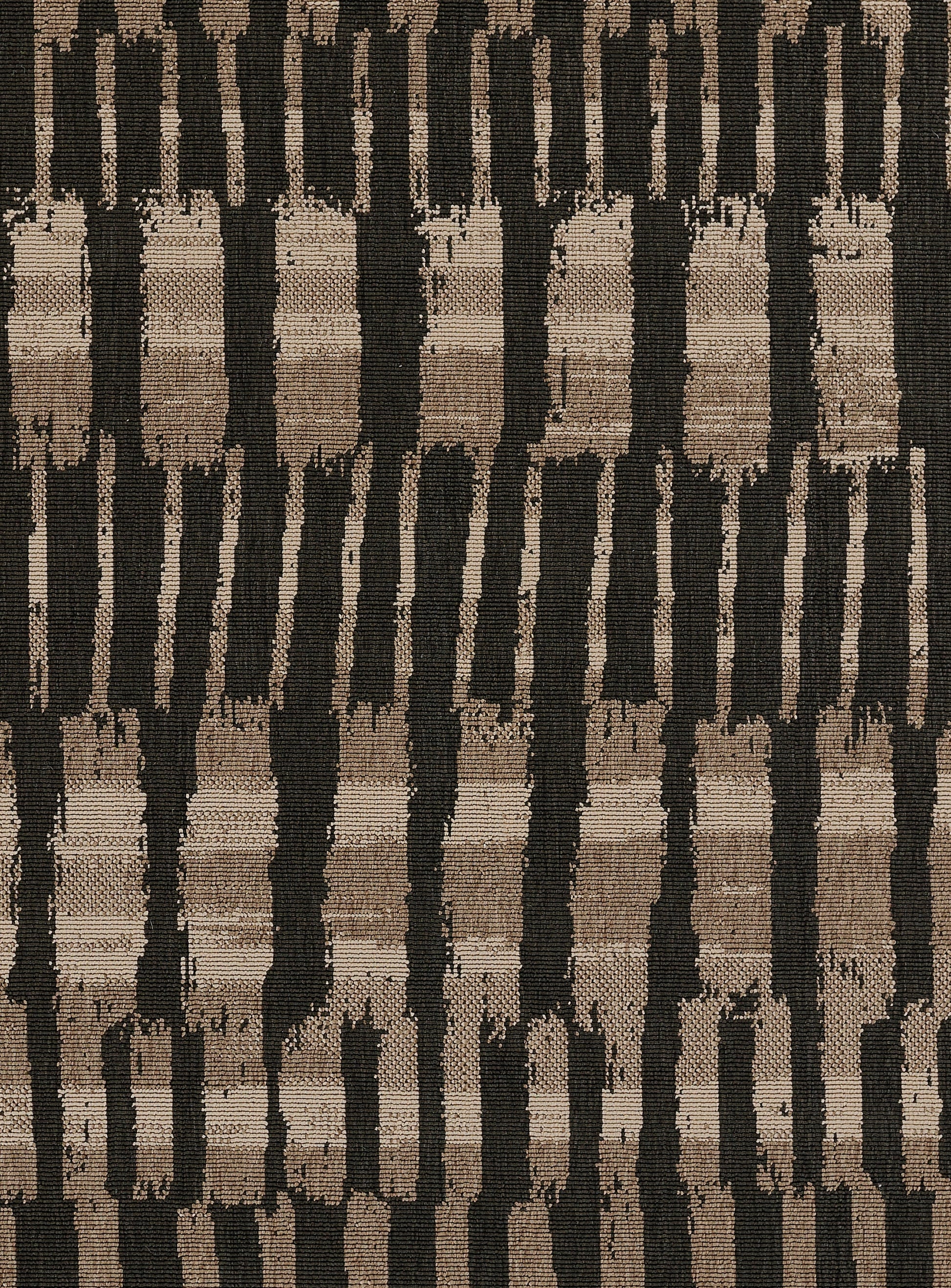 Tan, brown and black woven rug with vertical brushstroke stripes; rustic boho home decor.
