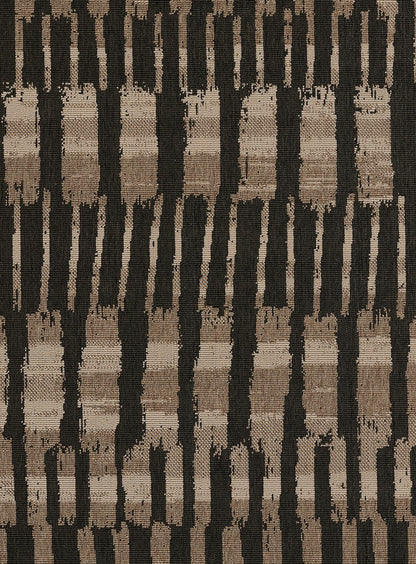 Tan, brown and black woven rug with vertical brushstroke stripes; rustic boho home decor.