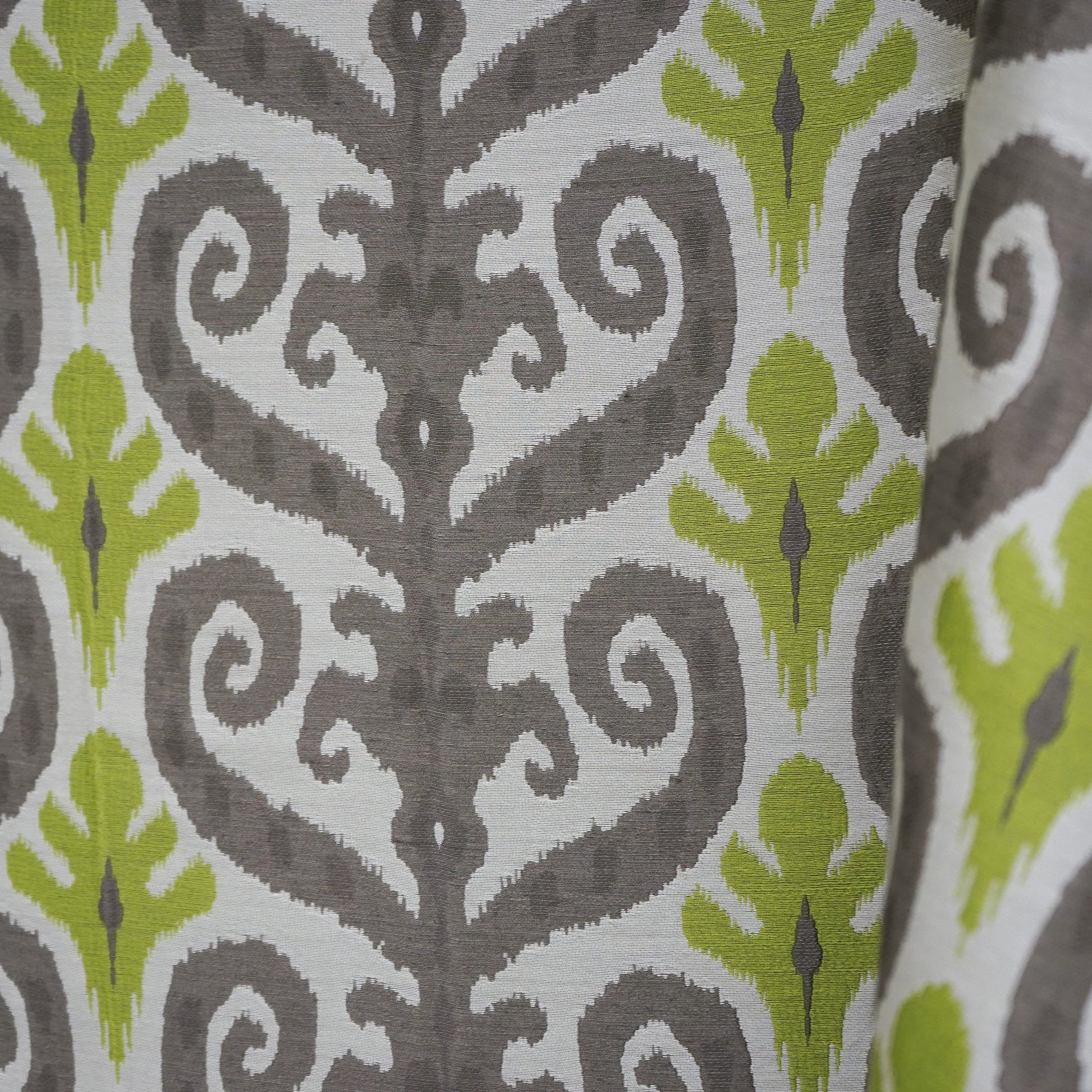 Damask pattern fabric with scroll motifs in creme, beige, green, grey, silver and taupe.