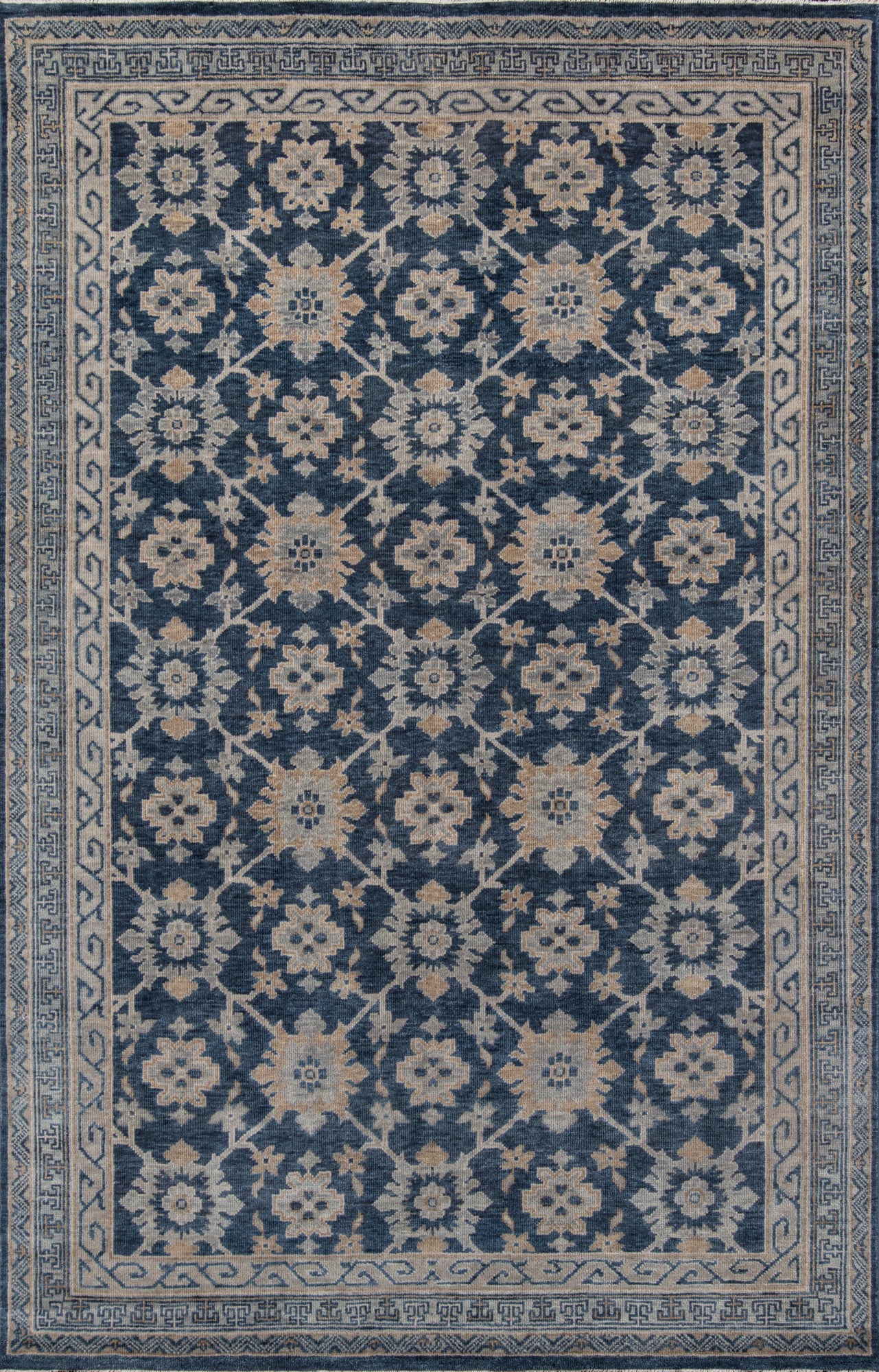 Blue floral oriental rug with ivory blossoms on deep indigo field; light geometric border.