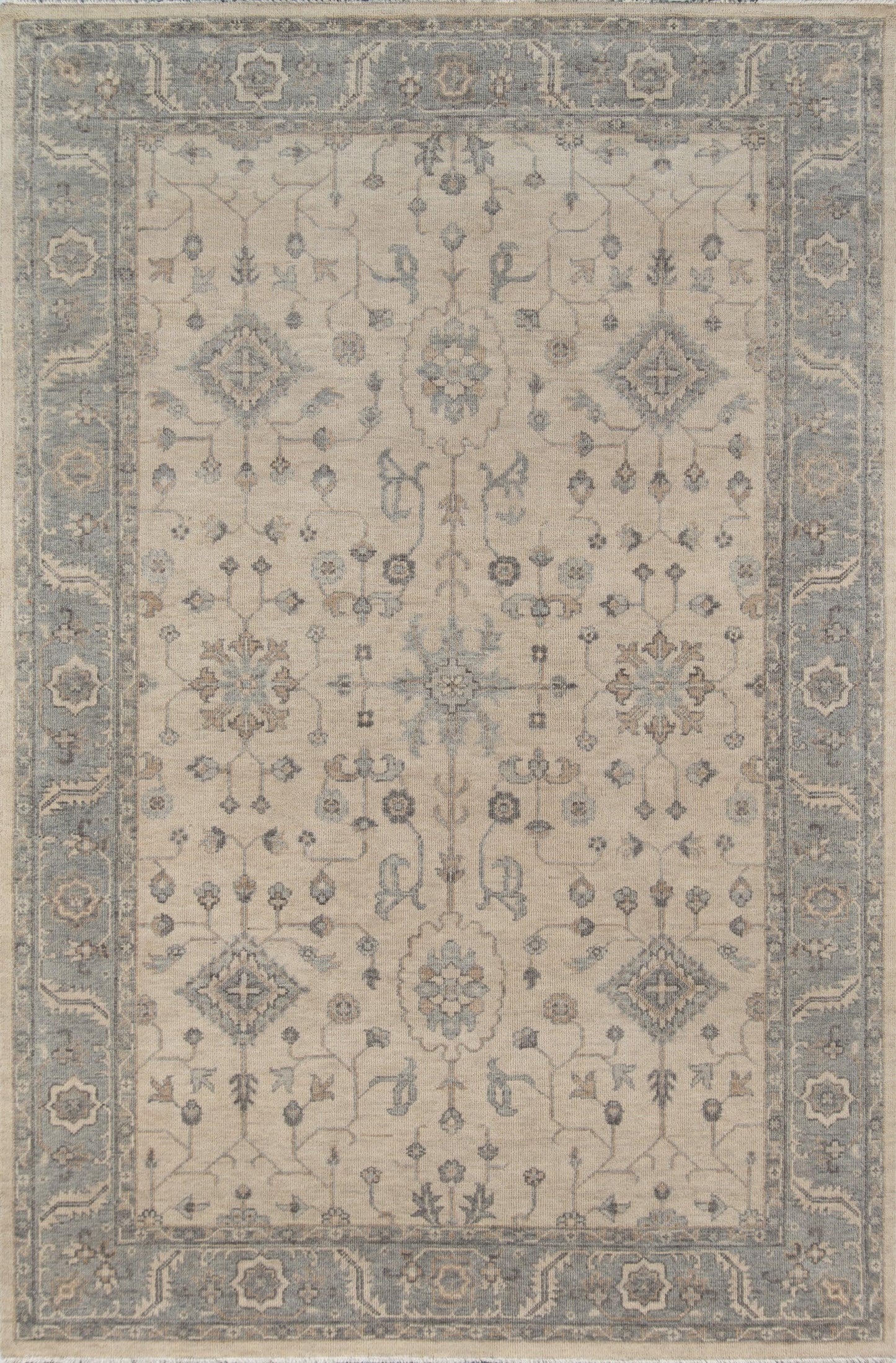 Beige oriental rug with blue border, featuring intricate floral medallions and scrolling vines; rectangular area rug.