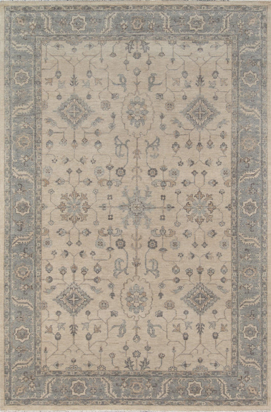 Beige oriental rug with blue border, featuring intricate floral medallions and scrolling vines; rectangular area rug.