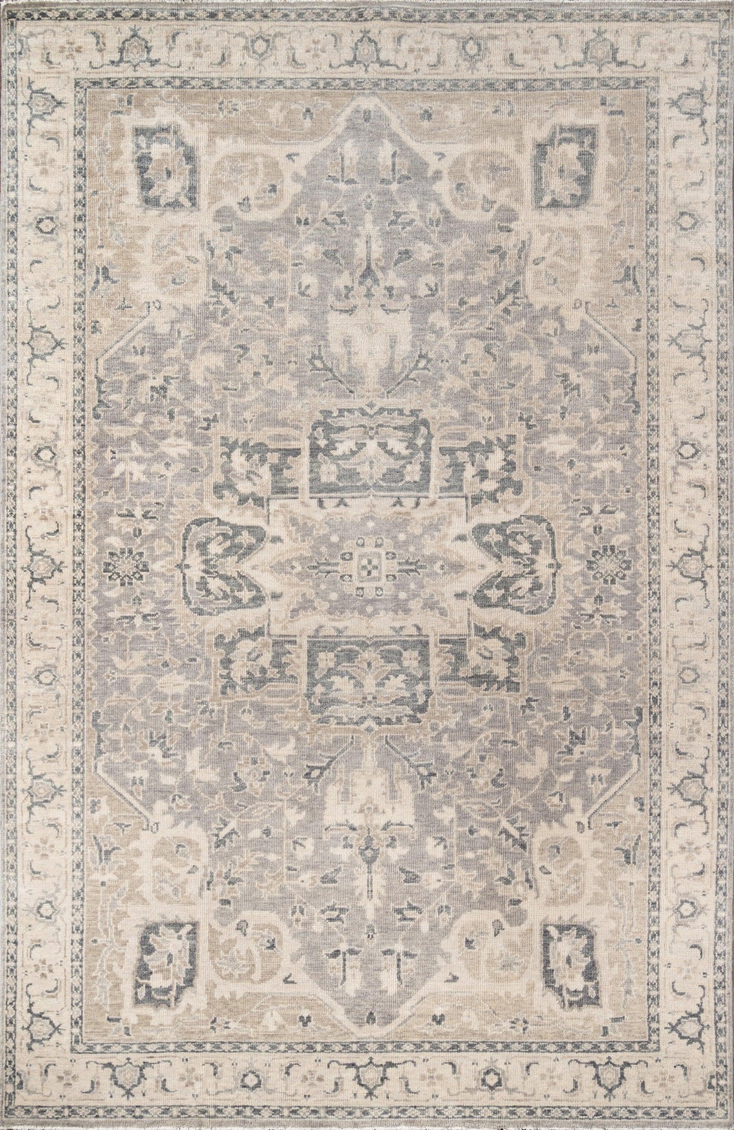 Traditional gray and ivory Persian-style area rug with central medallion, intricate floral motifs and decorative border.