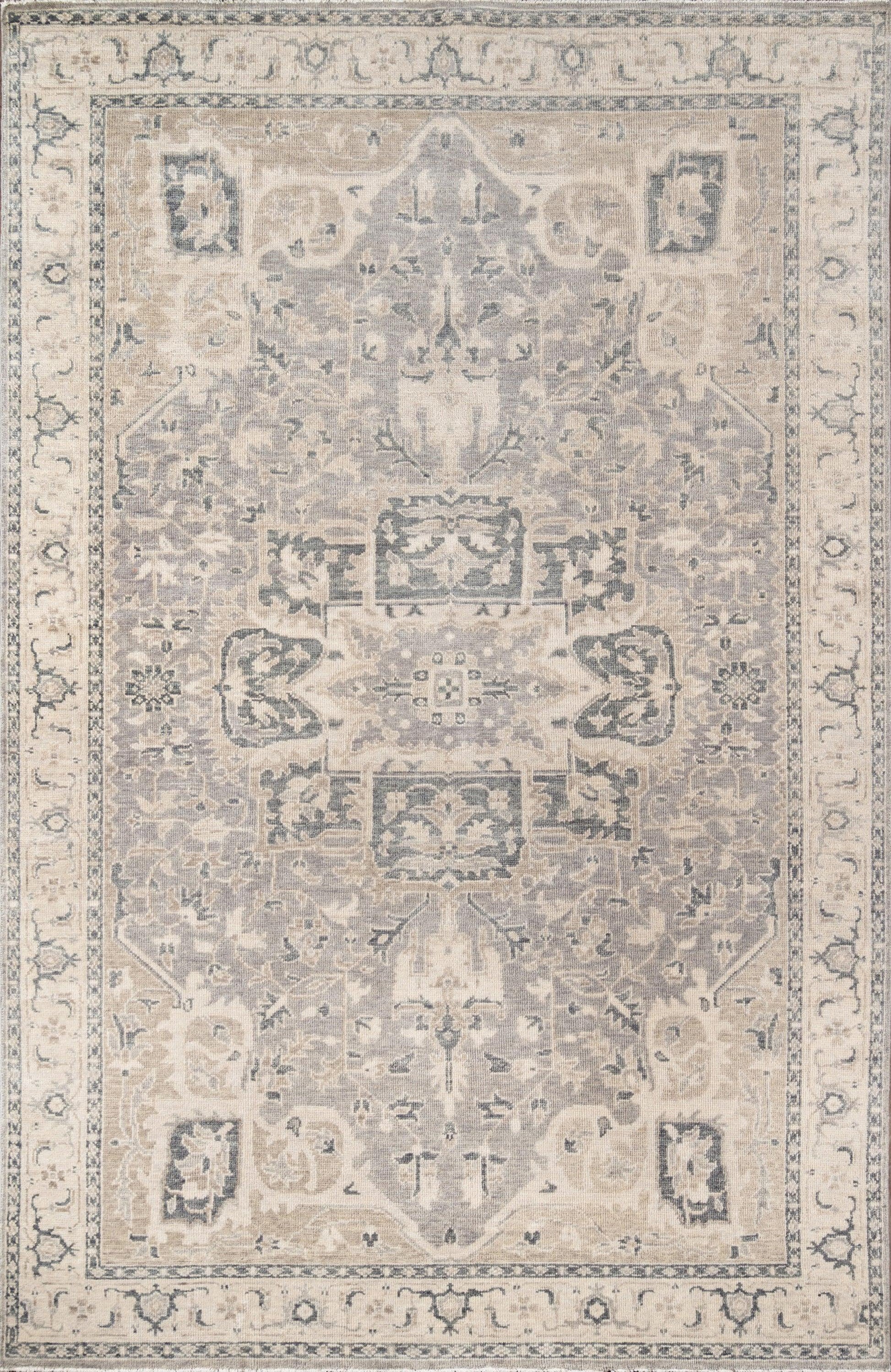 Traditional gray and ivory Persian-style area rug with central medallion, intricate floral motifs and decorative border.