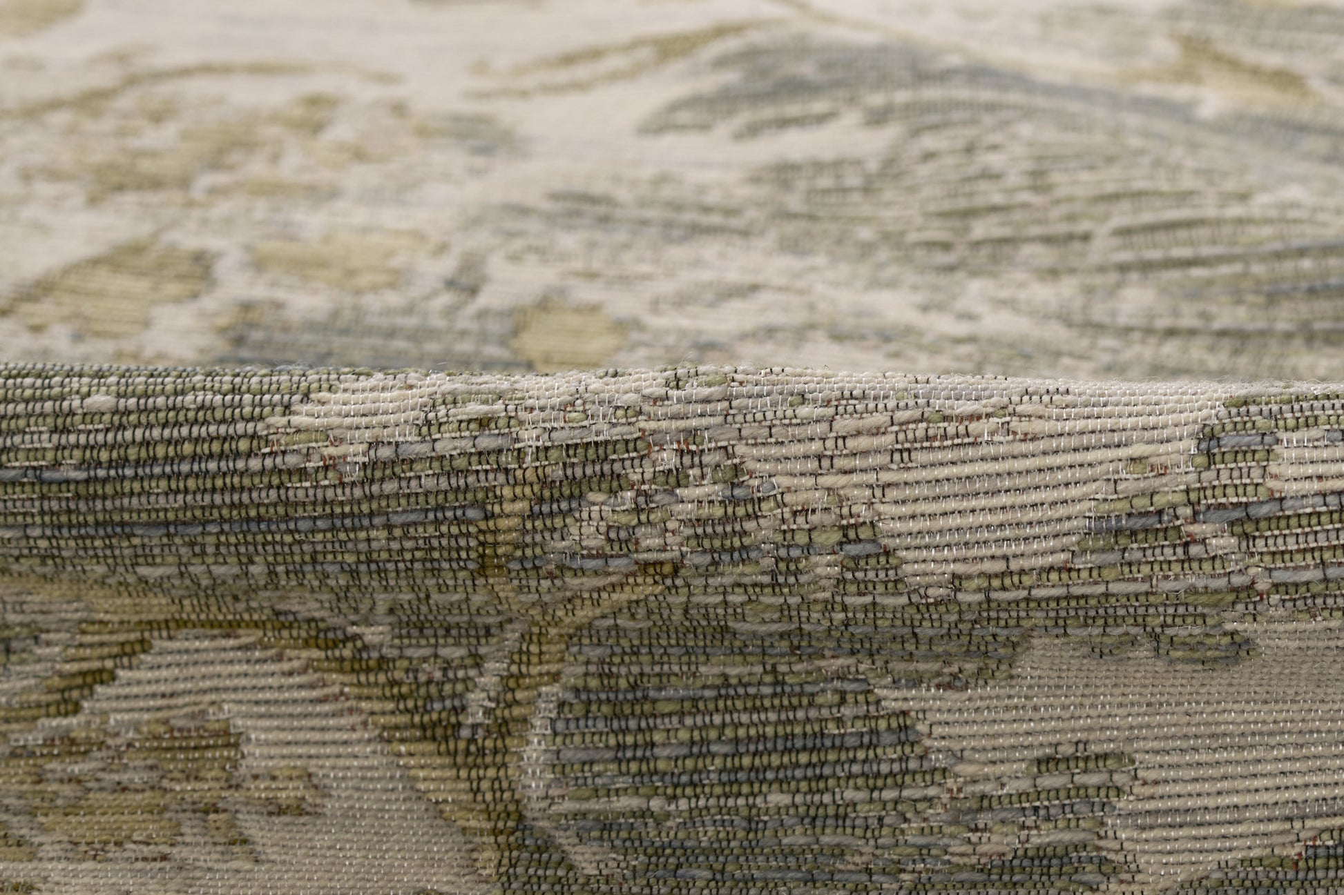 Earthy BARROBRN rug in beige, olive and brown with a floral damask pattern and woven texture.
