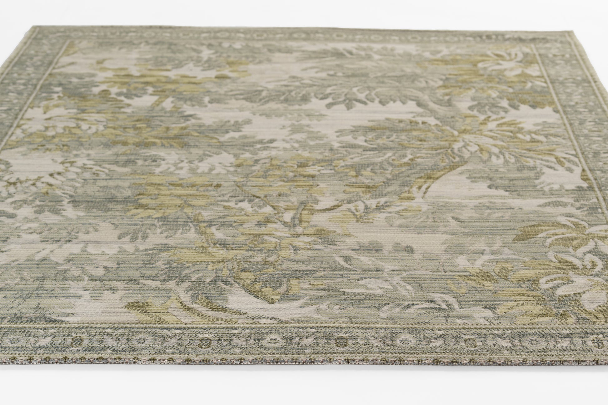 Neutral floral patterned area rug in gray, sage & beige with decorative border.