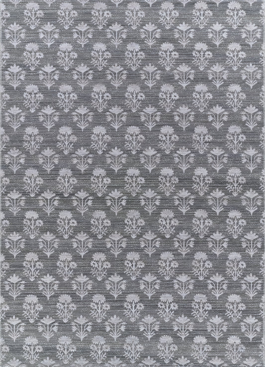 Blue-gray jacquard damask rug with light gray floral motifs, 7' x 9'.