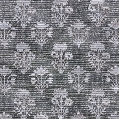 Gray-blue damask floral pattern rug with ornate blossoms on a dark charcoal background.