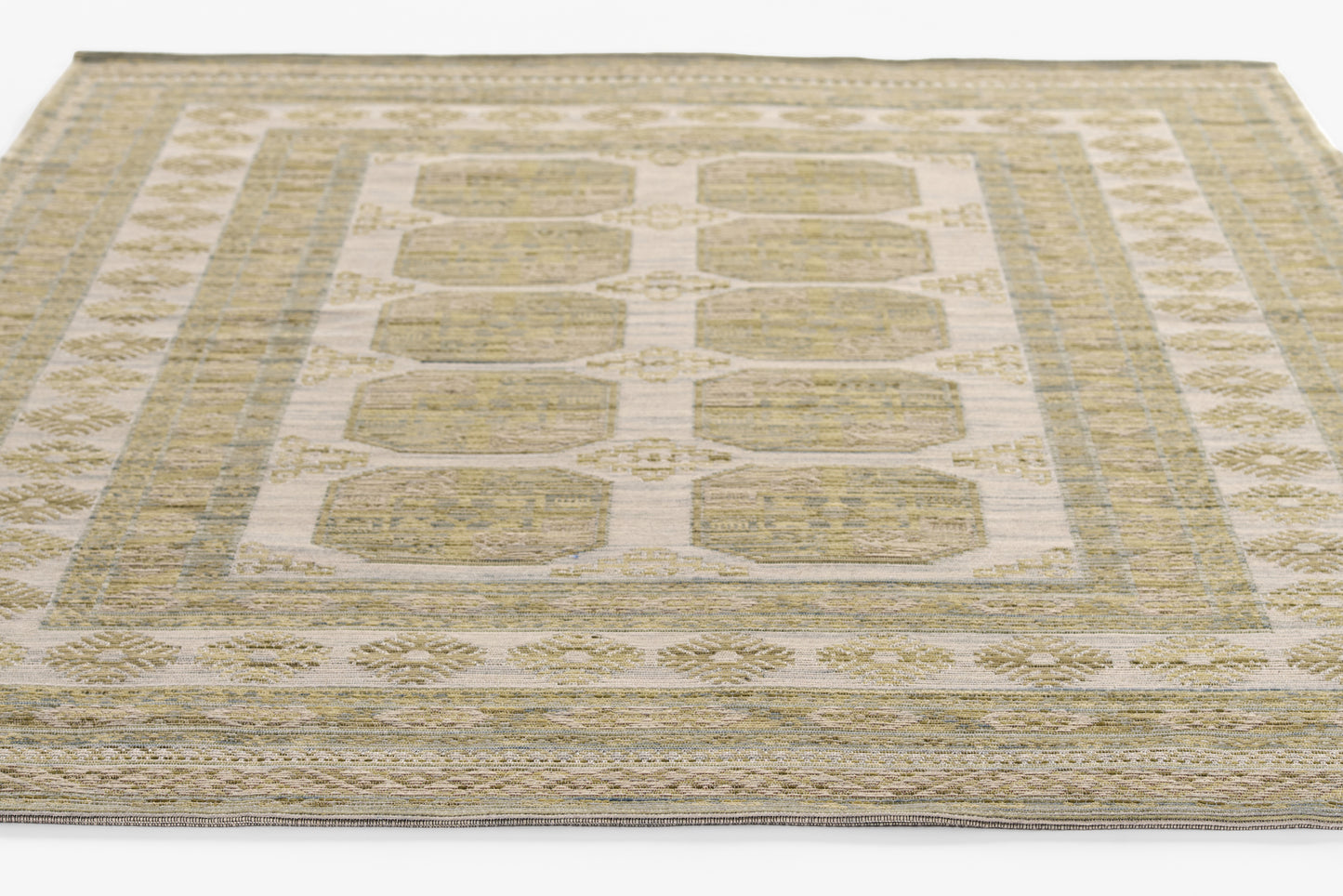 Beige cream flat-weave rug with pale blue accents, geometric rectangular blocks and decorative border.