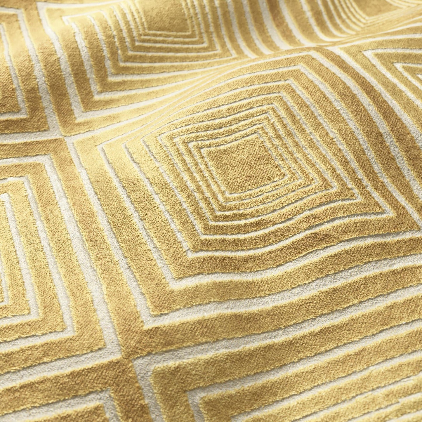 Gold, cream & rust geometric velvet fabric with a diamond pattern and plush texture.